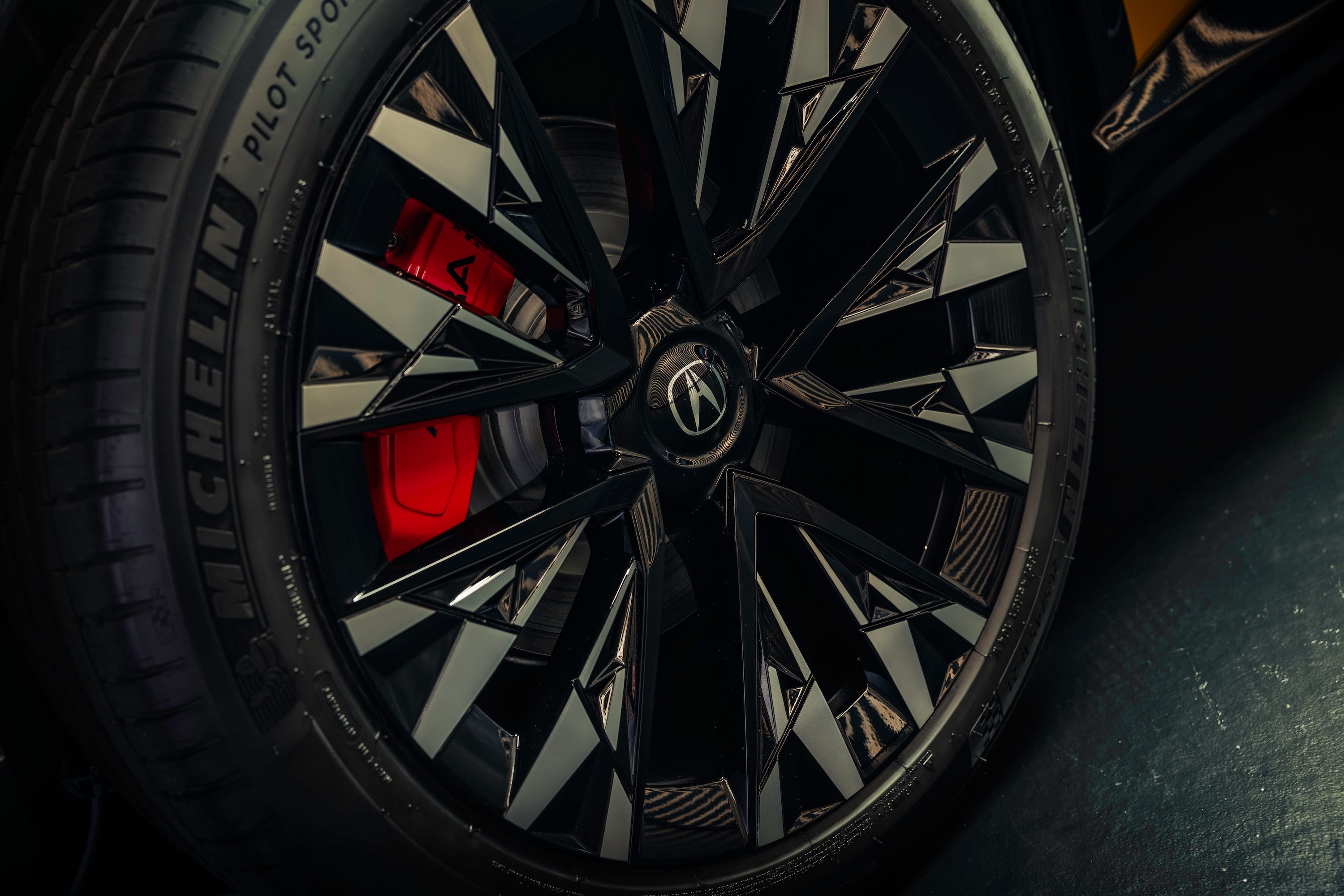 These 21-inch wheels have an intricate design, and the red Brembo brake calipers peeking through the spokes help provide stopping power.